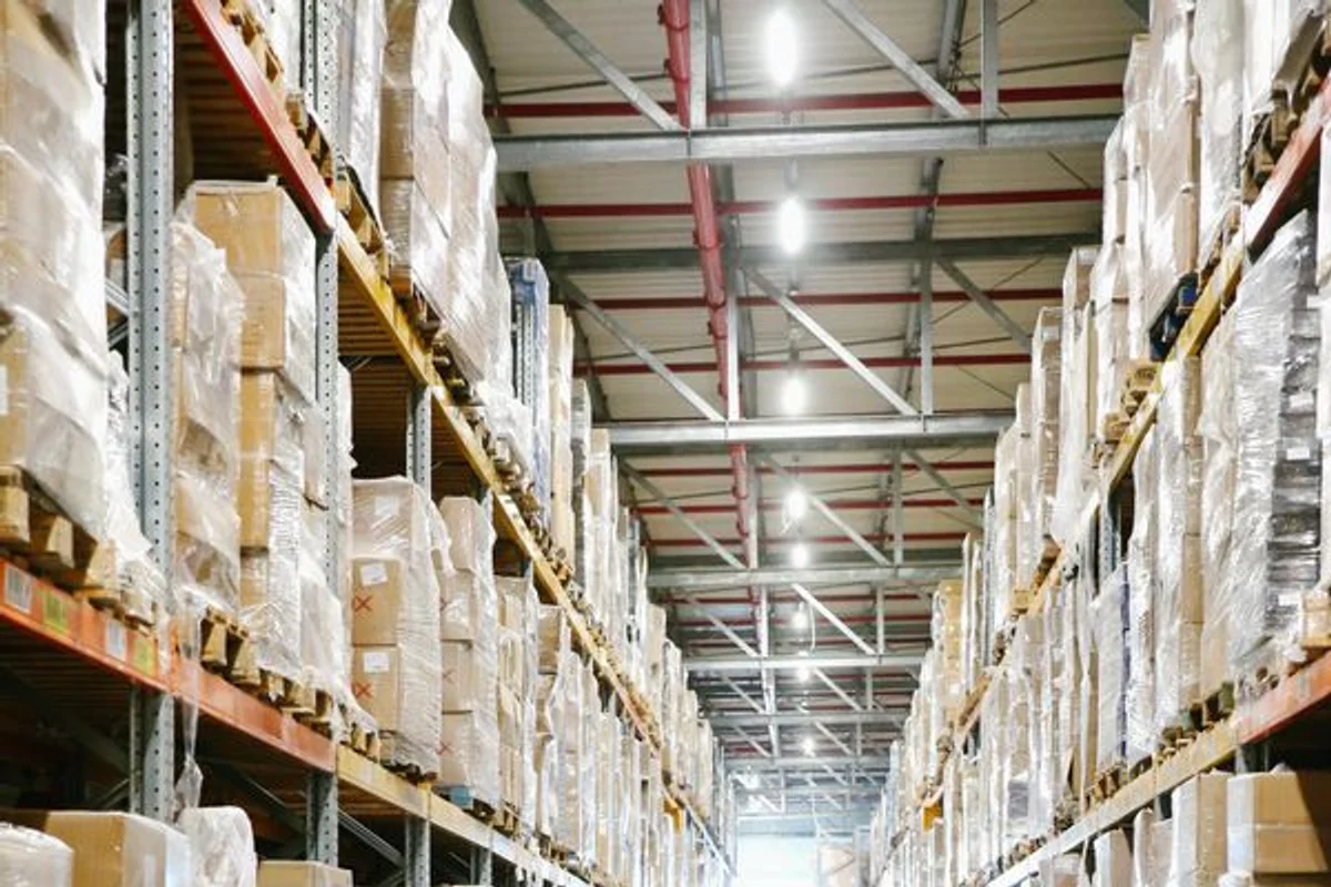 An organized ecommerce warehouse aisle filled with consolidated inventory